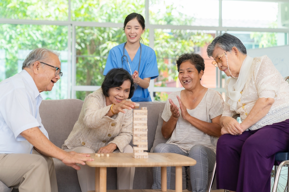 Seniors enjoying activities together with a nurse
