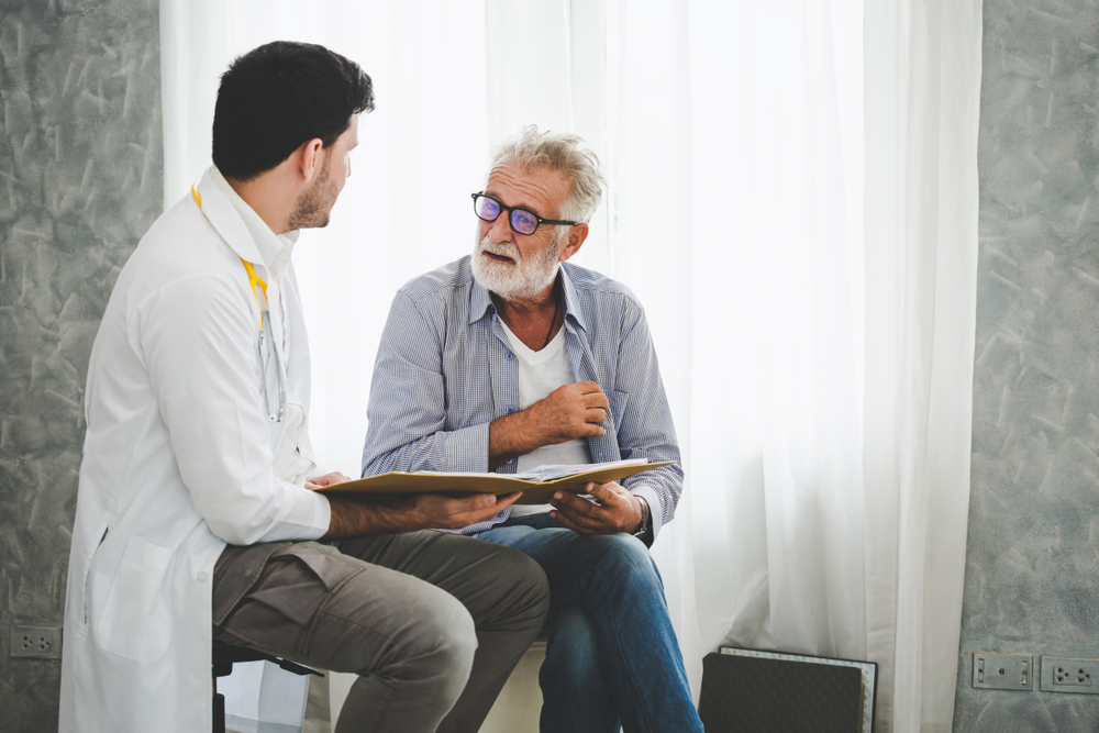 Speech therapist working with elderly patient